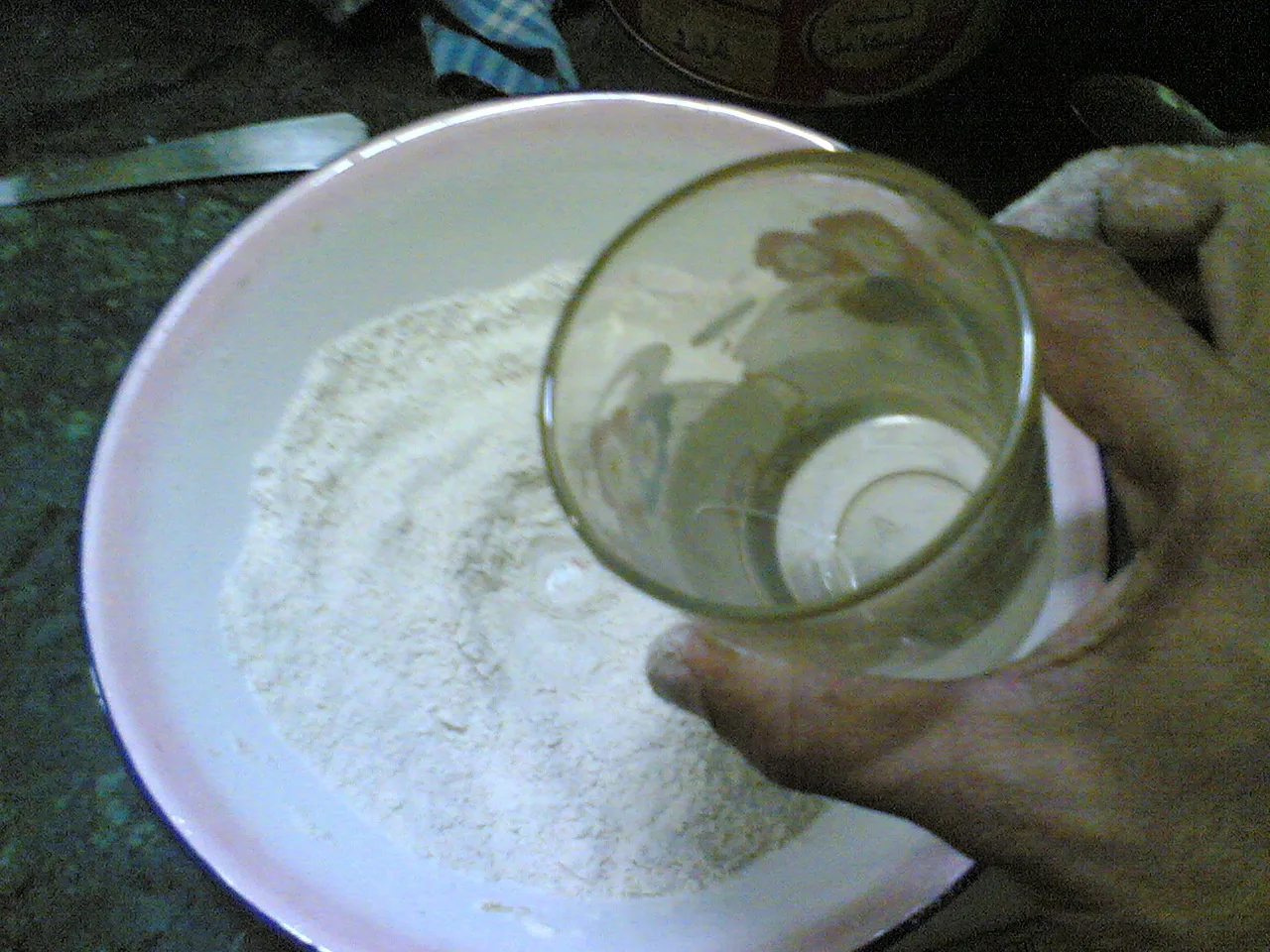 Water poured into a well in the flour before kneading.