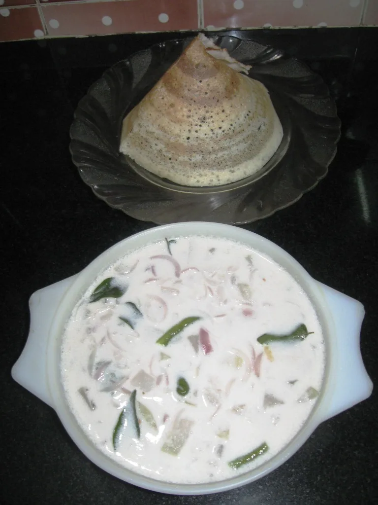 Cone dosa with coconut-milk vegetable stew.