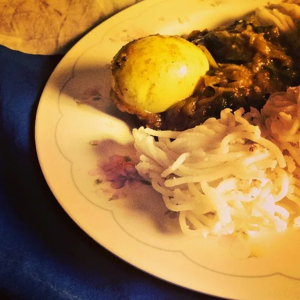 Idiyappam with egg roast — a Kerala breakfast plate.