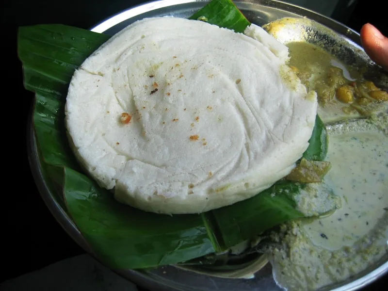 Thatte idli — a large, flat steamed cake.